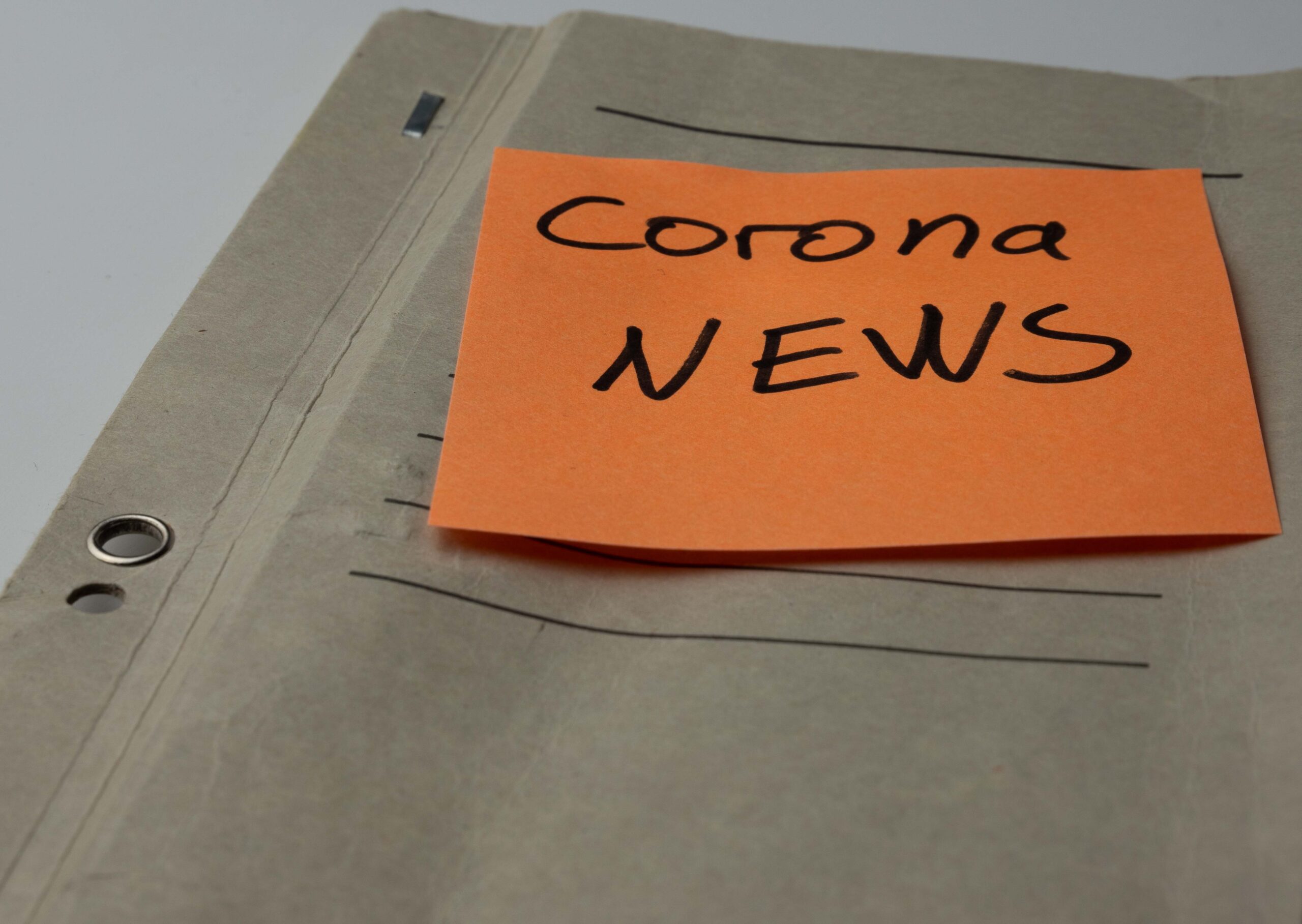 Corona News sticky note with stapler