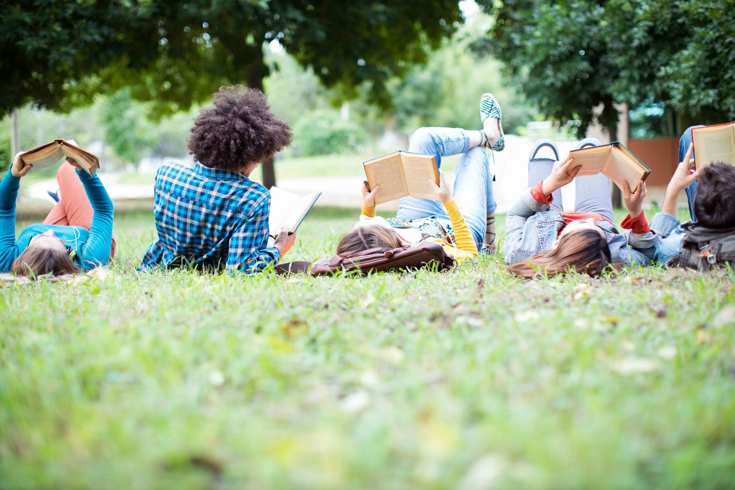 Students lie on meadow