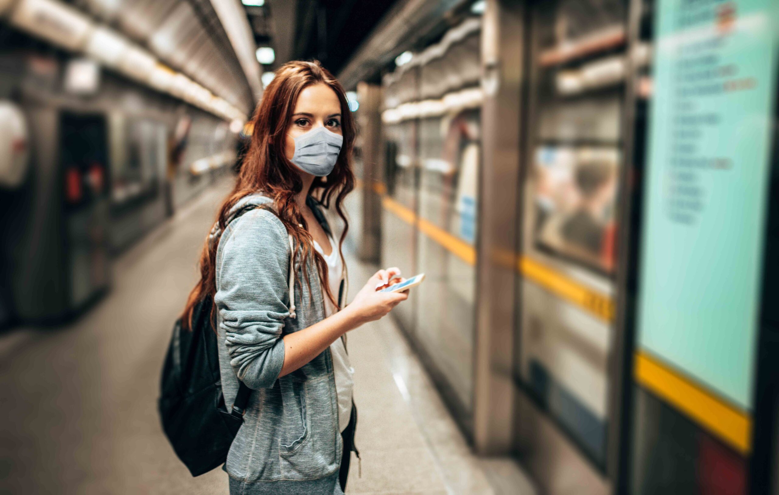woman with face mask in the station