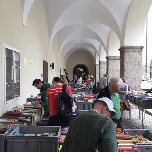 People browsing books at a book fair.